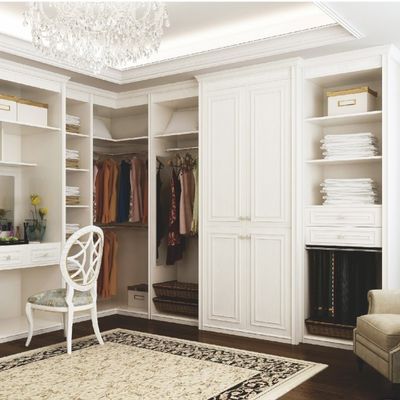 Custom L-Shaped Walk-In Closet with White Solid Wood Finish
